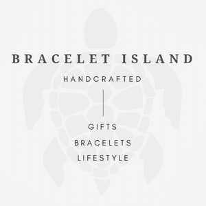 May include: A logo for Bracelet Island, a company that sells handcrafted gifts, bracelets, and lifestyle items. The logo features a stylized turtle with the company name and tagline "Handcrafted" above the turtle and the words "Gifts", "Bracelets", and "Lifestyle" below the turtle.