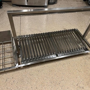 Santa Maria Grill Built in BBQ Cooking Grill -Argentine Barbecue V grate adjustable height-drop in 62 inches