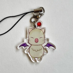 May include: A white and purple character with wings, a red ball on its head, and a black string attached to a silver clip. The character is a cartoon version of a popular video game character.