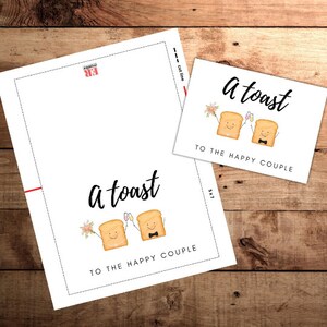 May include: Printable wedding toast card with a cute illustration of two pieces of toast holding champagne glasses and a bouquet of flowers. The text reads "A toast to the happy couple".