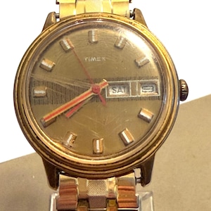 Timex 1970s Barcode Gold Tone Mercury Manual Day/Date Watch W Hong Kong Band RUNS