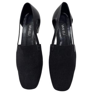 May include: A pair of black leather and mesh heeled shoes with cut-out details and the brand name "VAN ELI" printed on the inside of each shoe.