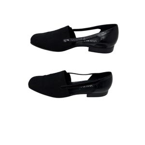 May include: A pair of black leather flats with a cut-out design and the text "VANELI" on the side.