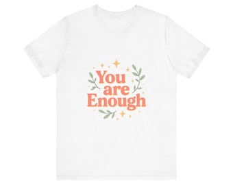 Camiseta "Eres suficiente" con mensaje positivo y detalles florales