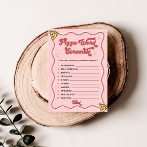 May include: A pink printable game card with the title "Pizza Word Scramble". The card has a list of pizza toppings with scrambled letters. Players unscramble the words to reveal the toppings.