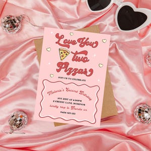 May include: Pink birthday party invitation with the text "Love You Two Pizzas" in red and white lettering. The invitation includes details for Melanie's second birthday party, including the date, time, location, and RSVP information.