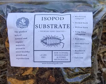 May include: A white bag with a label that reads "ISOPOD SUBSTRATE" and lists the ingredients: mushroom compost, orchid bark, willow bark, long fiber sphagnum, peat moss, shredded leaf litter, hardwood charcoal, and calcium. The bag contains a brown and black substrate for isopods, springtails, and other microfauna. The bag is labeled "1.8 LBS DRY".
