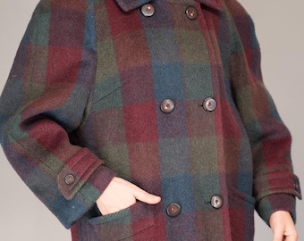 May include: A double-breasted coat featuring a large plaid pattern in shades of burgundy, forest green, and navy blue. The coat has a wide collar, long sleeves with buttoned cuffs, and two front pockets with dark brown buttons.