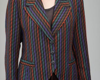 May include: A multi-colored striped blazer with a notched lapel, three-button closure, and two front pockets. The jacket features vertical stripes in red, green, purple, and brown. The blazer is approximately 28 inches long.