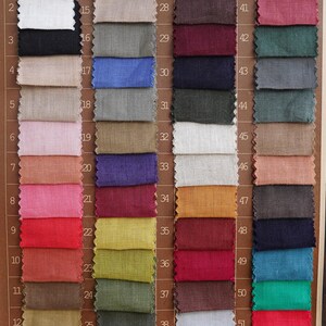 May include: A color palette featuring 52 fabric swatches in various colors, including white, black, pink, red, blue, green, and brown. Each swatch is numbered and labeled with a corresponding color name. The text "Colour palette" is visible.