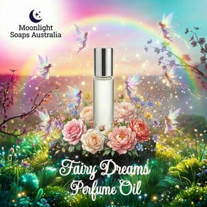 May include: A perfume oil bottle with a silver cap, set amidst pink and peach roses, fairies, and a rainbow. The text "Fairy Dreams Perfume Oil" is displayed in a decorative font. The Moonlight Soaps Australia logo is in the upper left corner.