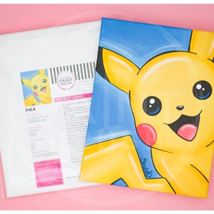 May include: A paint-by-numbers kit featuring a cartoon image of Pikachu, a yellow electric-type Pokémon, with a blue background. The kit includes a canvas, paint, and brushes. The instructions are printed on the back of the canvas.