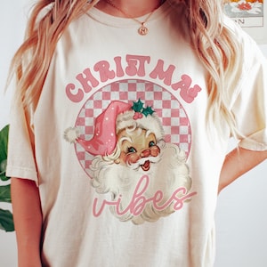 Pink Santa Christmas Vibes t shirt, women’s Christmas shirts, cute funny Christmas top, retro Santa Claus shirts, comfort colors ivory shirt