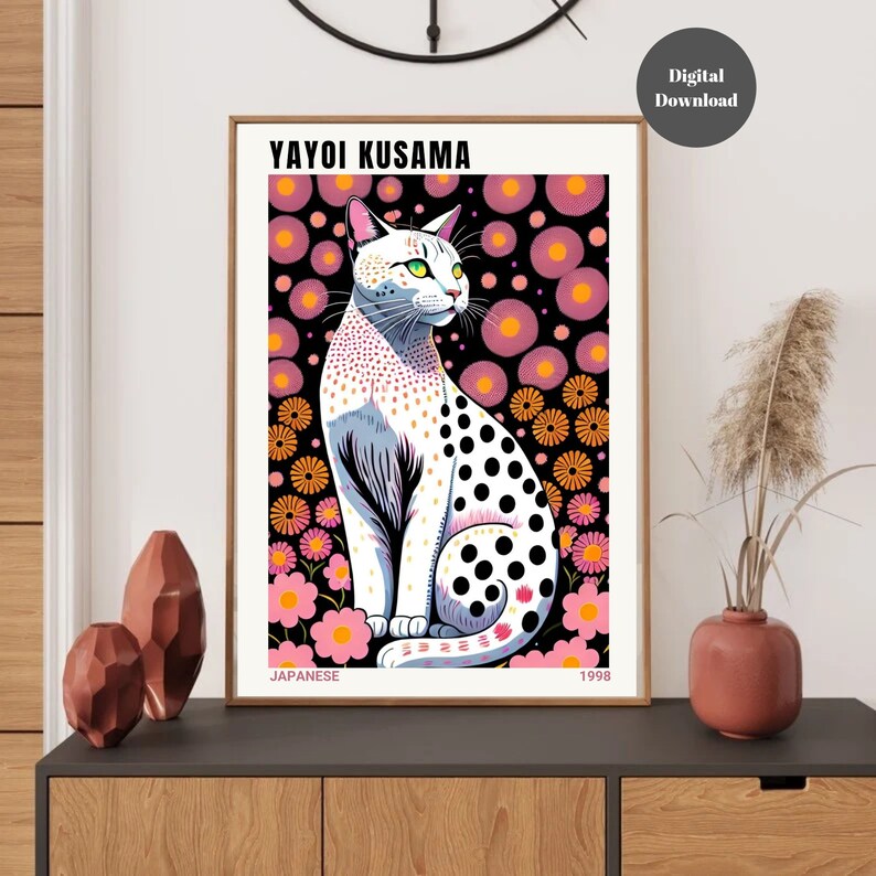 May include: A framed art print featuring a stylized white cat with black polka dots, green eyes, and a floral background. The print includes the text "YAYOI KUSAMA" and "JAPANESE 1998". The artwork is a digital download.
