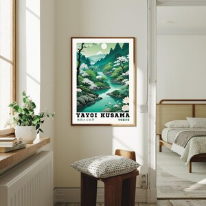 May include: A vintage-style poster featuring a green and blue landscape with a river flowing through it. The poster is titled "Yayoi Kusama" and includes the text "無限の宇宙" and "Tokyo".