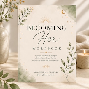 May include: A rectangular workbook titled Becoming Her Workbook with a cream-colored cover featuring green watercolor accents, gold line art of leaves, a sun, and a crescent moon. The text includes the subtitle A guided workbook to help you release what no longer fits and become the woman you're meant to be and Grounded & Glowing Grow. Become. Shine.