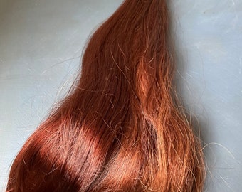 Cabello humano ruso, genuinos e impresionantes tonos rojos, suave y sedoso, un solo hallazgo raro.