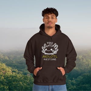 May include: A brown hooded sweatshirt with a white axolotl graphic and the text "You Axolotl Questions".