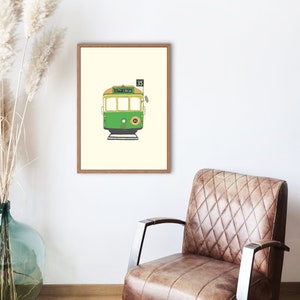 May include: A framed illustration of a green and yellow tram with the words "City Circle" and the number "35" on the side.