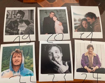 May include: A collage of ten Polaroid photos featuring a man with dark hair and a beard. The photos are arranged in two rows of five. The photos are all in black and white except for one photo which is in color. The photos are all of the same man in different poses and settings.