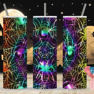 May include: Three stainless steel tumblers with a black background and a rainbow iridescent spider web pattern. The tumblers are decorated with a spider silhouette in each web.
