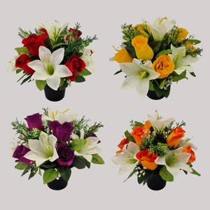 May include: Four artificial flower arrangements in pots. The arrangements feature white lilies and roses in red, purple, yellow, and orange.