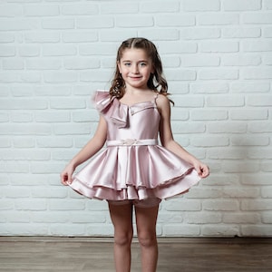 Little girls in short dresses shop