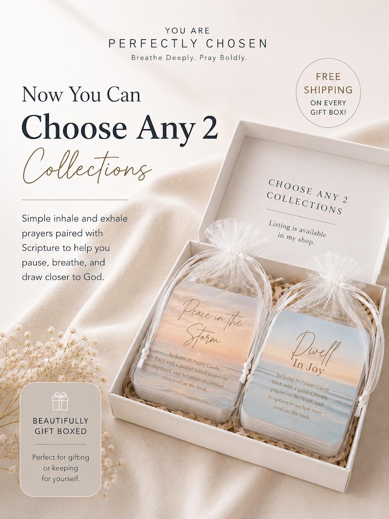 May include: A white gift box containing two sets of prayer cards in sheer white organza drawstring bags. Each card set features a sunset beach scene with the text Peace in the Storm and Dwell In Joy, including 30 cards with guided prayers.