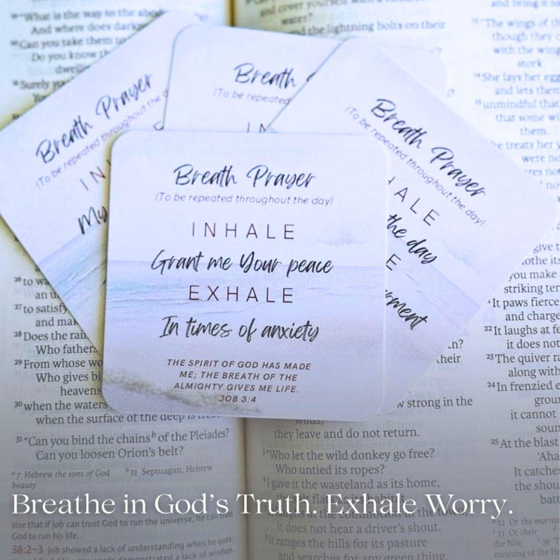 May include: A set of square white cards with rounded corners featuring the text Breath Prayer, Inhale, Grant me Your peace, Exhale, In times of anxiety, and the Bible verse Job 33:4, set against a soft blue ocean horizon background.