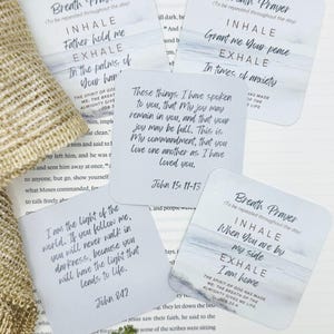 May include: Four square cards with rounded corners featuring printed religious text and watercolor-style blue and white imagery. The cards display various verses and breath prayers, including references to John 15:11-13, John 8:12, and Job 33:4.