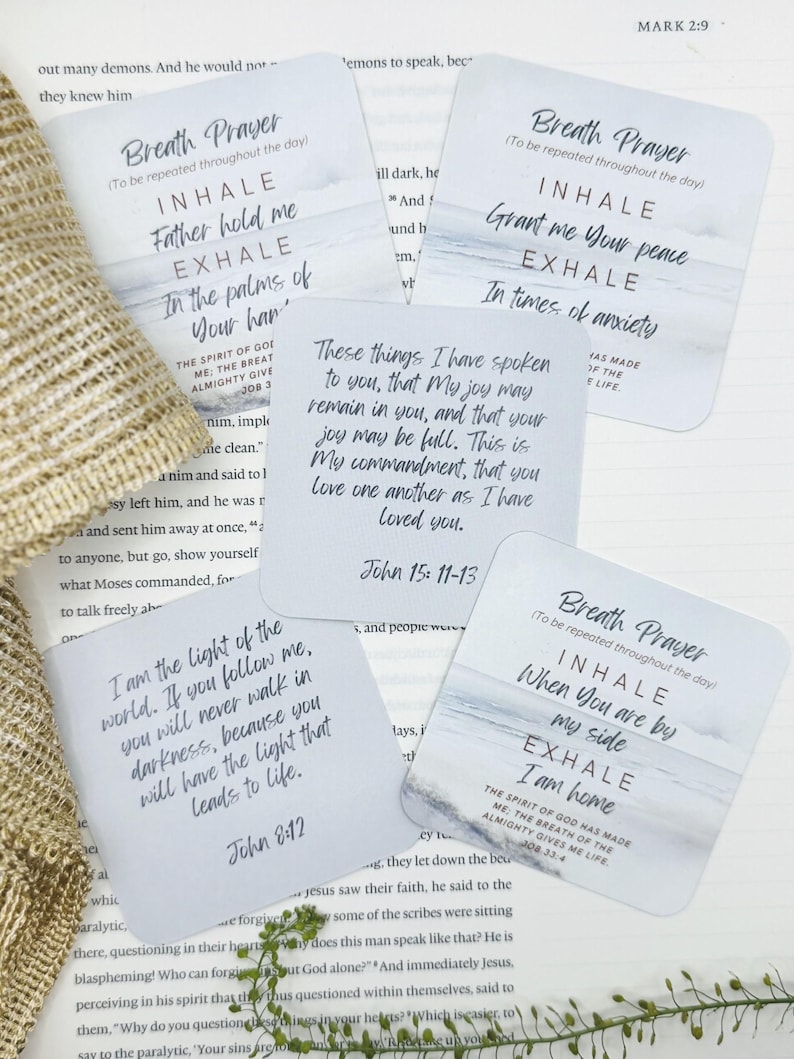 May include: Four square cards with rounded corners featuring printed religious text and watercolor-style blue and white imagery. The cards display various verses and breath prayers, including references to John 15:11-13, John 8:12, and Job 33:4.