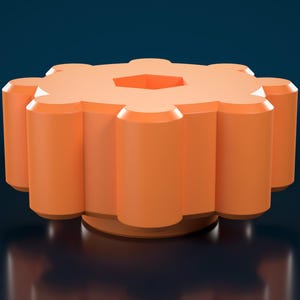Puede incluir: Un pomo de color naranja brillante con forma de engranaje y una hendidura hexagonal central en la parte superior. El objeto tiene una base cilíndrica y una serie de crestas verticales redondeadas en su perímetro. El texto NeckTechnology es visible.