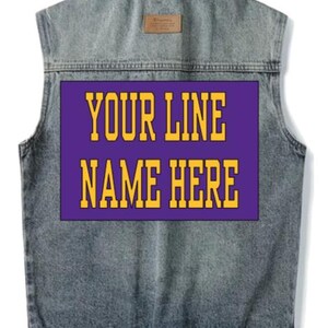 May include: A sleeveless denim jacket with a purple rectangular patch on the back. The patch features the text "YOUR LINE NAME HERE" in gold block letters. The jacket has a button closure and a small brown patch near the collar.