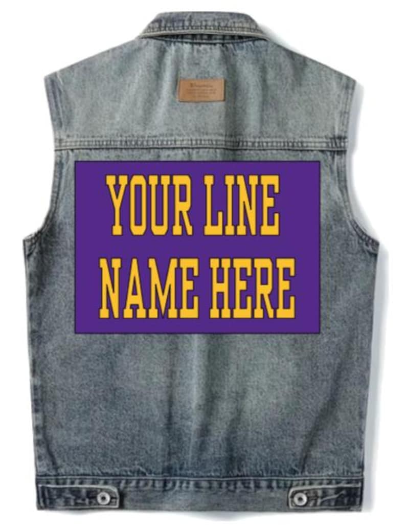 May include: A sleeveless denim jacket with a purple rectangular patch on the back. The patch features the text "YOUR LINE NAME HERE" in gold block letters. The jacket has a button closure and a small brown patch near the collar.