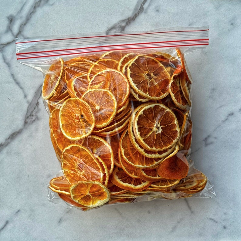 Dried orange slices food. Dried fruits. Orange dehydrated food. Holiday DIY mixology cocktail garnish mulling spice image 8