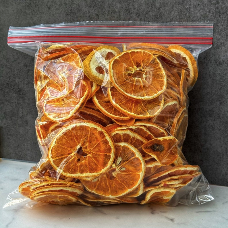 Dried orange slices food. Dried fruits. Orange dehydrated food. Holiday DIY mixology cocktail garnish mulling spice image 9