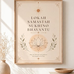 May include: A framed art print with a beige background displays the text "LOKAH SAMASTAH SUKHINO BHAVANTU" and "May all beings everywhere be happy and free." The design includes a lotus flower, sun, and botanical elements in brown and green.
