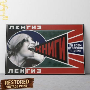 May include: A framed vintage poster with a black border. The poster shows a black and white image of a woman shouting, with the word "BOOKS" in red. The text "LENGIZ" is at the top and bottom. The words "RESTORED VINTAGE PRINT" are at the bottom.