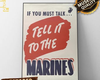 Pode incluir: Um poster vintage emoldurado com o texto "IF YOU MUST TALK... TELL IT TO THE MARINES" em branco e azul marinho sobre um fundo creme. Uma pincelada vermelha destaca o texto central. O poster inclui "RESTORED VINTAGE PRINT".