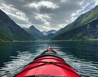 Kayaking in Norway. The mighty Norwegian Fjord. Viking photos. Kayak photos. Travel Pictures. Red Kayak. Mountain Reflections.