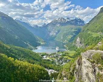 Clouds and Sun over Geirangerfjord Norway. Grand Place on Canvas. Magical Places in a Photo. Landscapes of the World with a Dramatic Scale.