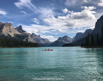 Blue Glacier Lake with Red Canoe Paddling Yonder in National Park Mountain Landscape Canvas Print. Canada Photography. Gifts that Inspire.