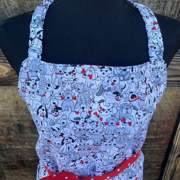 Puppy love! Adult size apron. Fully reversible with pockets on both sides and elastic neckstrap.