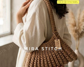 May include: A tan crochet shoulder bag with a ribbed design. The bag has a long, thick strap and a small tag that says "Mira Stitch". The text "PDF & VIDEO CROCHET PATTERN" is in the upper right corner. The text "MIRA STITCH" is at the bottom.