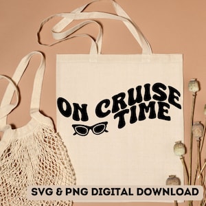 May include: A white tote bag with black text that reads "On Cruise Time" in a retro font. Sunglasses are below the text. The bag is on a brown surface with dried flowers.