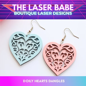 May include: A pair of heart-shaped earrings with a delicate, lacy design. The earrings are made of wood and are painted in light blue and pink. The earrings are called "Doily Hearts Dangles" and are sold by "The Laser Babe Boutique Laser Designs".