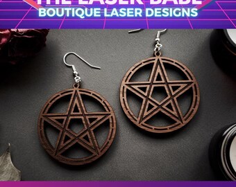 May include: A pair of wooden earrings with a pentagram design. The earrings are brown and have a silver hook. The earrings are called "Pentagram Dangles".