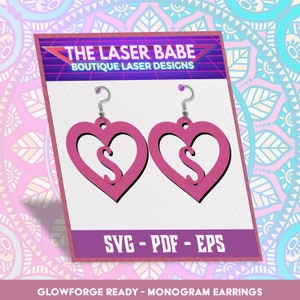 May include: A pair of pink heart-shaped earrings with a letter "S" cut out in the centre. The earrings are for laser cutting and are labelled "SVG - PDF - EPS" and "GLOWFORGE READY - MONOGRAM EARRINGS".