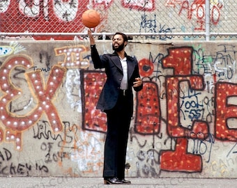 Walt Frazier Portrait in front of graffiti covered wall.