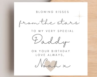May include: A white card with gray text that reads "Blowing kisses from the stars to my very special Daddy on your birthday love always, Noah x". A small beige heart is next to the signature.